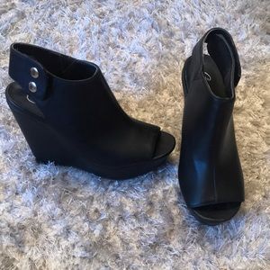 Black leather peep toe wedges